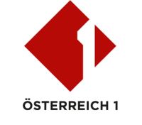 Schriftzug Österreich 1 in rot und schwarz auf weißem Untergrund 