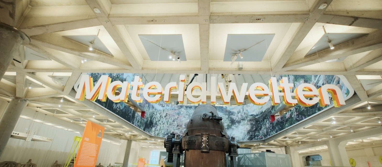 “Material Worlds” exhibition at the Vienna Museum of Technology featuring a large LD converter vessel and colourful signage at the centre.: 
