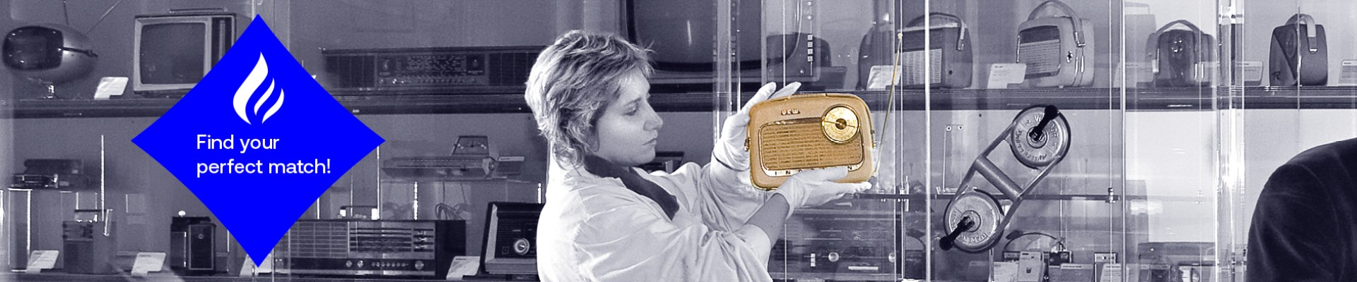 A person in gloves holding up a vintage radio in a museum display, with the slogan “Find your perfect match!” in a blue diamond shape on the left.: 