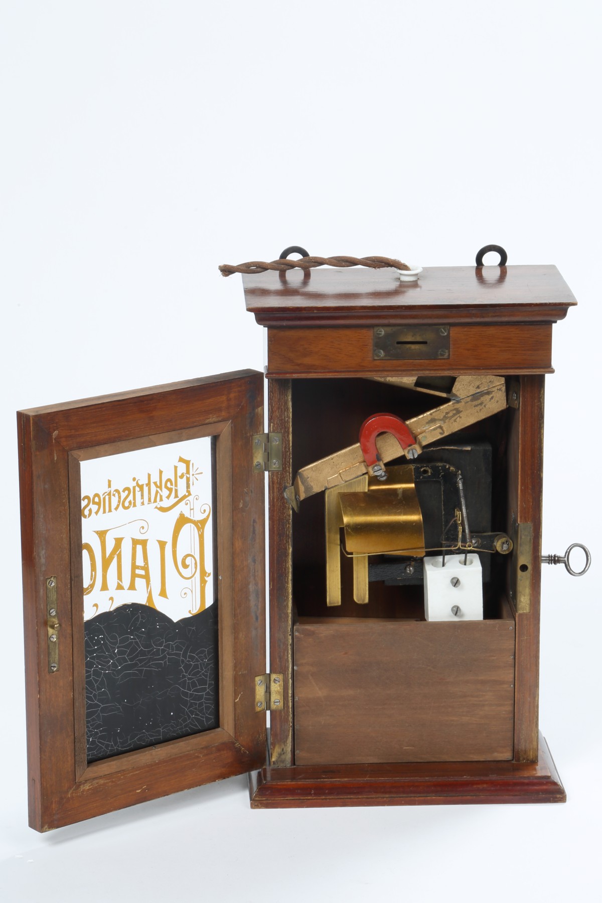 Münzprüfer für ein elektrisches Piano, um 1910 (Inv.-Nr. 77543)