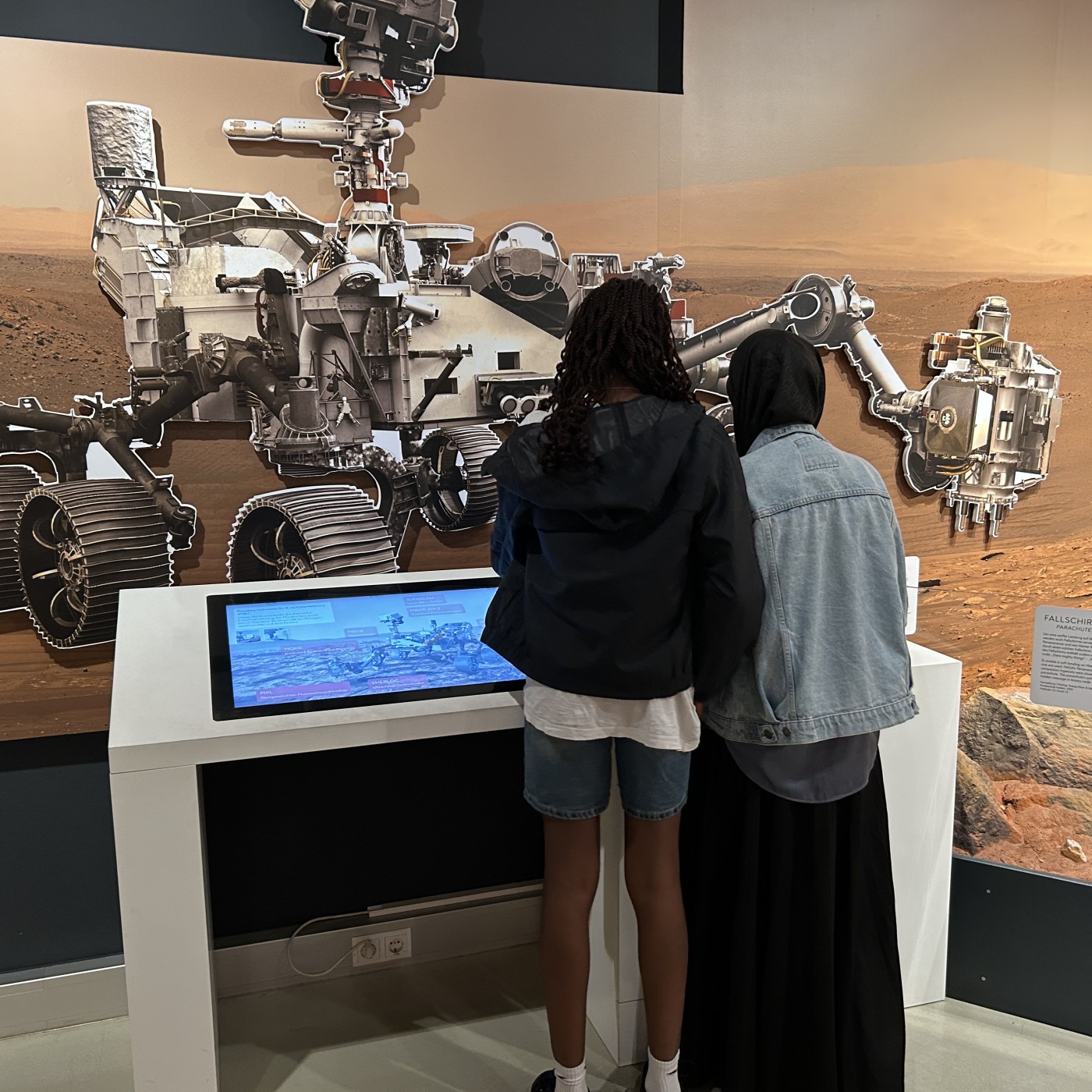 : This isn't their first visit to the exhibition: The Planet Hunters are discerning visitors who scrutinize every corner of the exhibition.